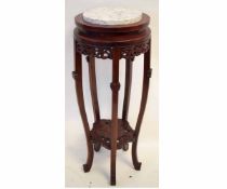 Chinese hardwood circular plant stand with marble top with carved gallery and floral carved second