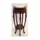 Chinese hardwood circular plant stand with marble top with carved gallery and floral carved second