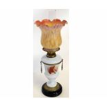Victorian French oil lamp on a black slag glass base with an opaque glass body with painted portrait
