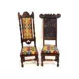 Two oak high backed hall chairs, one with cresting rail bearing date, each with upholstered seats