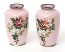 Pair of Japanese cloisonne vases with sprays of roses against a pink ground, plated mounts, probably