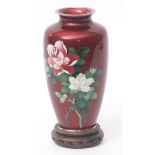 Japanese cloisonne and gin bari enamel vase decorated with roses against a translucent ruby red