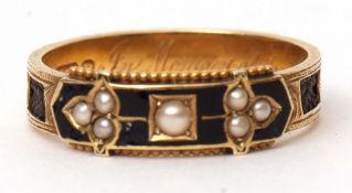 15ct gold enamel and seed pearl mourning ring, the black enamel panel highlighted with small seed