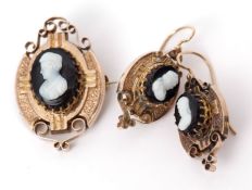 Mid-grade yellow metal and hard stone cameo set to include brooch and earrings, each with relief