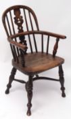 19th century yew and oak child's hoop back armchair, central pierced splat, solid seat, and raised