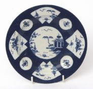 18th century Bow porcelain small plate or stand, the blue ground decorated with panels with river