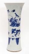 Chinese blue and white porcelain transitional style beaker vase with aquatic garden scenes below