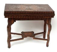 Damascus games table, circa early 20th century with good quality marquetry inlays, the folding top