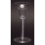 18th century wine glass with ornate air twist stem, plain spreading circular foot, 15cms high