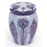 Early 20th century Moorcroft Hesperian ware jar and cover, decorated with a Florian design, 12cms