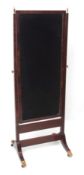 Regency period mahogany cheval mirror, typical rectangular plate over splayed supports with gilded