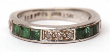 18ct white gold emerald and diamond half eternity ring, alternate set with three small emeralds