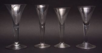 18th century ale glass of conical form with plain air drop stem and spreading circular foot,