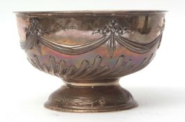 Late Victorian rose bowl of circular form with embossed floral and swag and wrythen half fluted