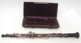 An Oboe stamped F Loree Paris in plush lined case, approx 60cms long