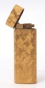 Late 20th century gold plated personal gas cigarette lighter, Cartier, 7412909, of oval form with