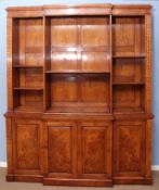 Burr oak library bookcase of break front form, the upper section with fitted adjustable shelving