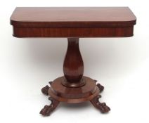William IV period mahogany tea table with folding and swivelling top over a plain frieze, raised