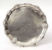 Victorian small waiter of shaped circular form with applied border, polished field and raised on