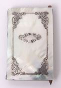 Late 19th century silver detailed and mother of pearl aide memoire, the rectangular panels set to