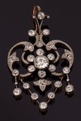 Precious metal diamond openwork articulated pendant, the principal old cut diamond 0.30ct approx,