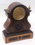 Mid-19th century walnut and ebonised stencilled mantel clock, the arched case with overhanging