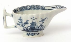 Lowestoft butter boat, circa 1770, the reeded body decorated with a pagoda and flower design, the