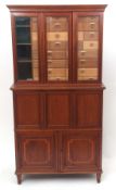 Late 19th century mahogany and satinwood cross-banded specimen cabinet with moulded top over three