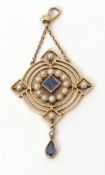 Edwardian sapphire and seed pearl open work pendant, having a central square cut sapphire in a