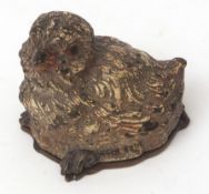 Late 19th century novelty cold painted bronze stamp case modelled in the form of a chick with hinged