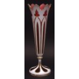 Overlaid glass spill vase with everted pointed rim, overlaid in white with gilded detail