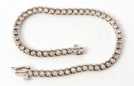 Precious metal diamond tennis bracelet, with 56 diamonds, half bezel set, gross wt approx 2ct,