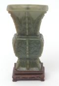 Chinese green hardstone vase, probably jade, of archaic form, on original hardwood stand, inlaid