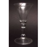 18th century small balustroid stem wine glass with spreading circular folded foot, 13 1/2cms high