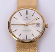 Last quarter of 20th century Swiss centre seconds calendar wrist watch, Bucherer, the movement (