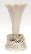 Belleek trumpet vase, the base finely applied with a series of moulded flowers, Belleek Co Fermanagh