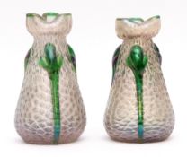 Pair of early 20th century glass vases with trefoil necks, the iridescent bodies overlaid with green