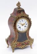 Late 19th century French boule type mantel clock, the waisted case surmounted by a floral urn finial
