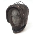 Early 20th century leather mounted fencing face mask with wire work frame and sprung mount and