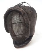 Early 20th century leather mounted fencing face mask with wire work frame and sprung mount and