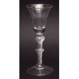 Conical bowl wine glass with balustroid air twist stem on spreading circular foot, 17 1/2cms high