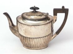 Edward VII tea pot of half fluted oval form with hinged and domed cover, length 22cms, wt approx