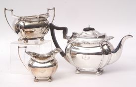George V three-piece tea set comprising tea pot, sugar basin and milk jug, each of waisted and lobed