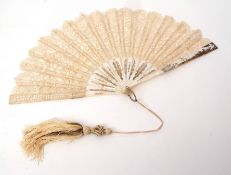 Late 19th/early 20th century mother of pearl, silver and lace fan of 16 stick construction with