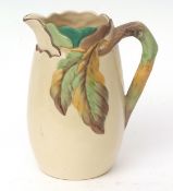 Large cream coloured jug with moulded leaf pattern, 24cms high