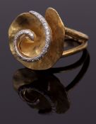 Flora Due ring by Vendorafa, stylised design of an open flowerhead with a central highlighted spiral