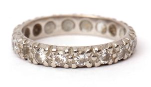 Precious metal diamond full eternity ring, set with 18 small diamonds in a continuous band, size O