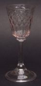 Low Countries conical wine glass with faceted bowl, plain balustroid stem terminating in a spreading