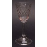 Low Countries conical wine glass with faceted bowl, plain balustroid stem terminating in a spreading