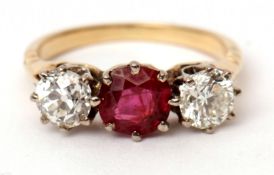 Precious metal ruby and diamond three-stone ring, the circular cut ruby 0.73ct (est) between two old